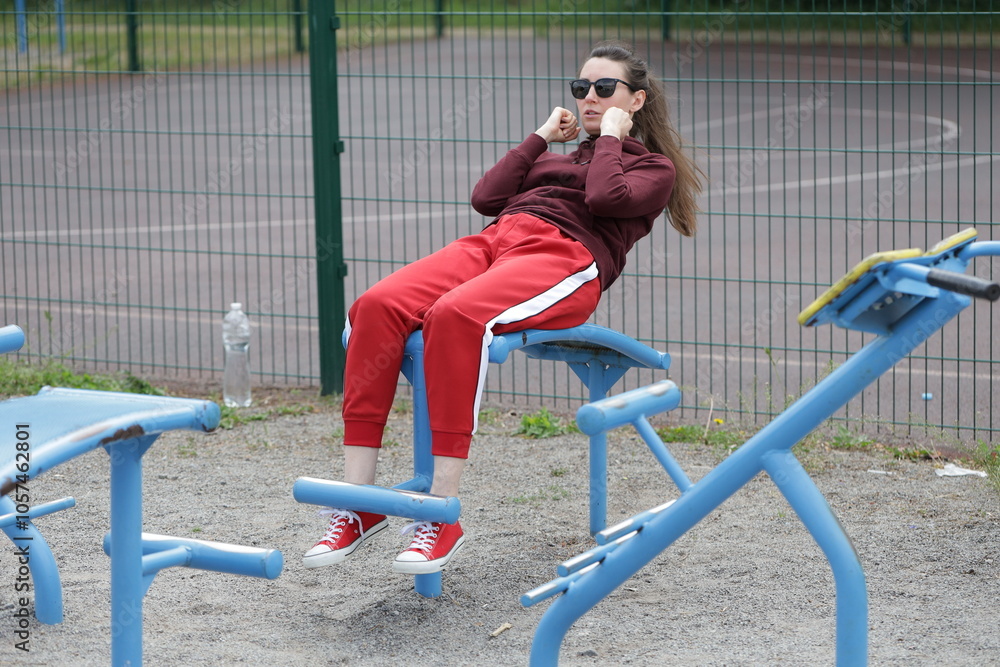 Fototapeta premium Woman exercising or doing workout session outside 