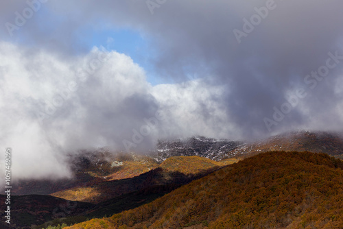 Photographs from the viewpoint over the Valley of Riaño, often called the 'Fiords of León,' in Spain. The stunning landscape includes vast blue waters surrounded by dramatic mountain peaks that resemb photo