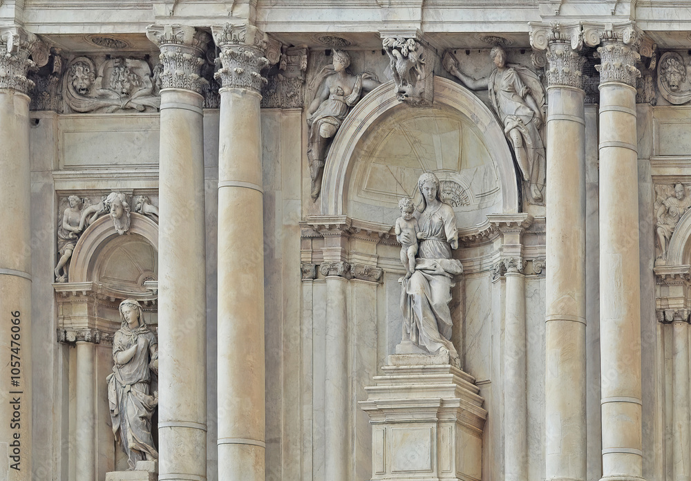 Detail of the front gable of Santa Maria di Nazareth church in Venice, with baroque religious sculptures with missing limbs Detail of the front gable of Santa Maria di Nazareth church in Venice, with baroque religious sculptures with missing limbs