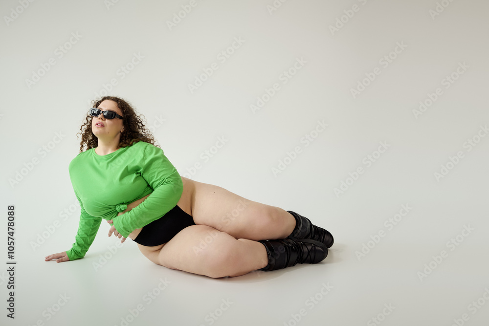 A confident plus size woman showcases her unique style in a bold green outfit and chic accessories. A confident plus size woman showcases her unique style in a bold green outfit and chic accessories.