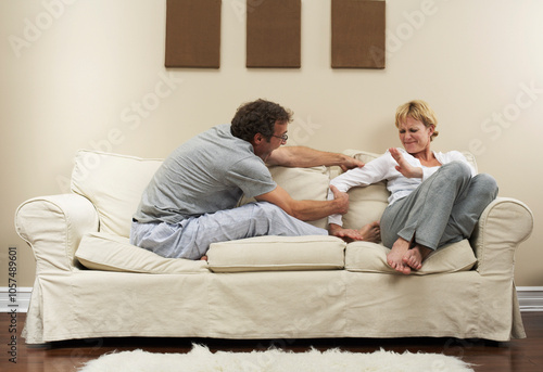 Couple Arguing on Sofa photo