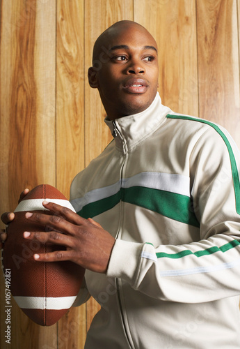 Portrait of Man Holding Football photo