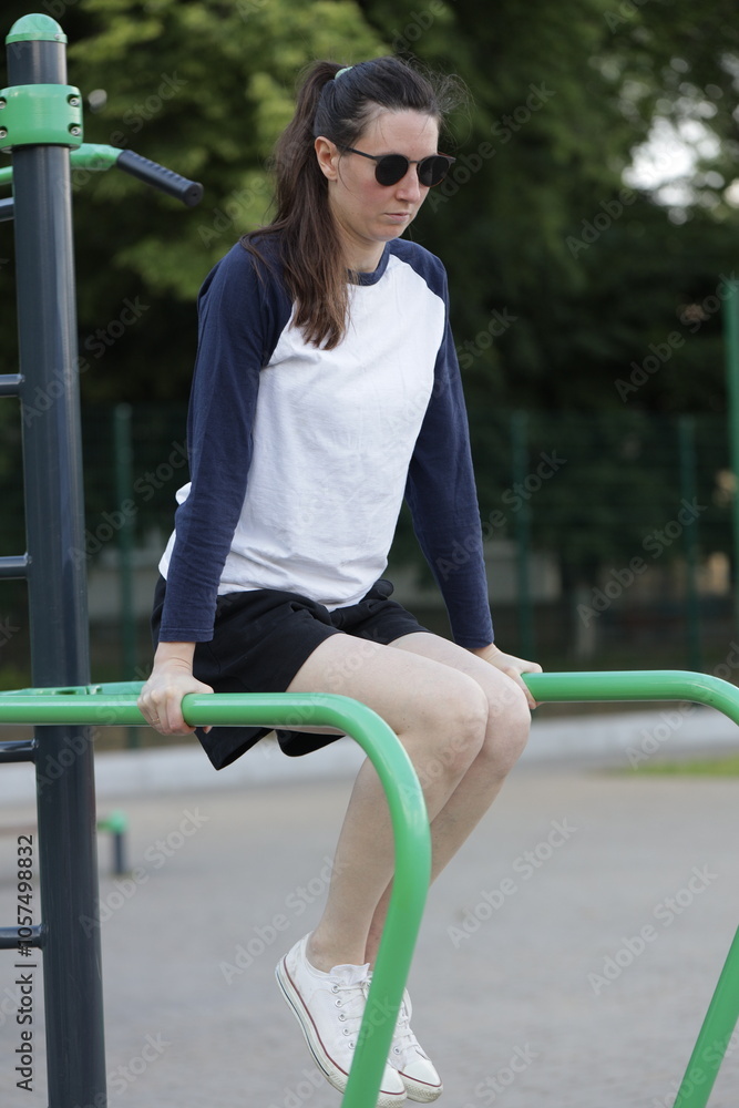 Fototapeta premium Woman exercising or doing workout session outside