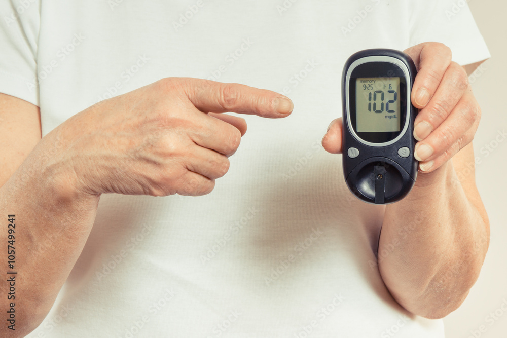 Senior woman and glucometer with result of sugar level. Diabetes in old age Senior woman and glucometer with result of sugar level. Diabetes in old age