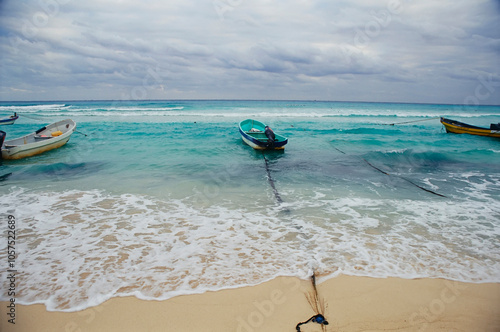 Boats tied up on a beach at Playa Del Carmen, Riviera Maya, Mexico; Playa Del Carmen, Quintana Roo, Mexico photo