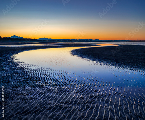 Beach and rippled sand before sunrise at White Rock; British Columbia, Canada photo