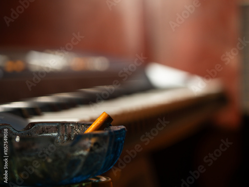 Принти на полотні Cigarette in bar near with piano organ musical instrument
