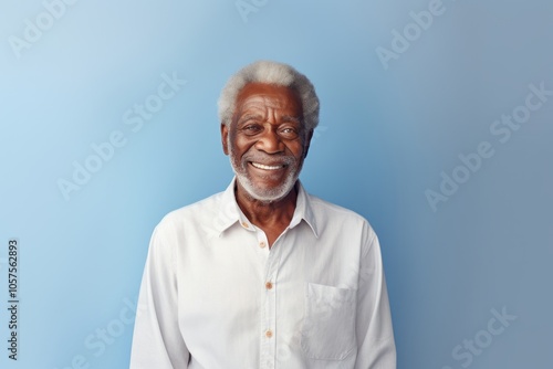 Portrait of a tender afro-american elderly man in his 90s sporting a versatile denim shirt isolated on plain white digital canvas