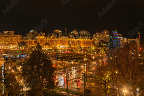 Night photo of Victoria Harbour on Vancouver Island with the Empress Hotel in the background and the city lit up with Christmas lights; Victoria, Vancouver Island, British Columbia, Canada photo