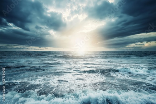 Powerful ocean waves under dynamic sky with sunlight piercing through dramatic clouds.