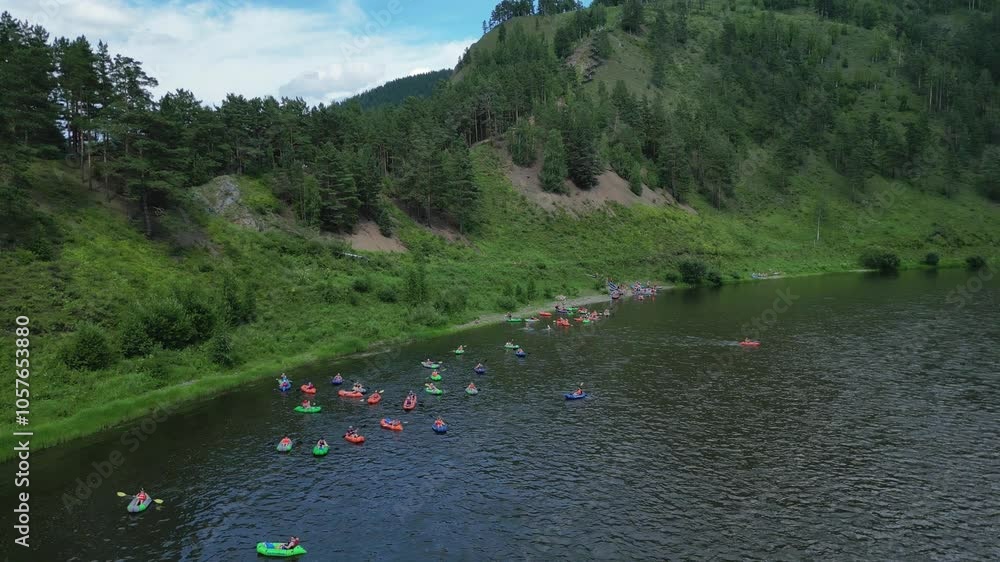 Kayakers Adrift On Flowing Waters Of siberian River. aerial tilt-up Kayakers Adrift On Flowing Waters Of siberian River. aerial tilt-up