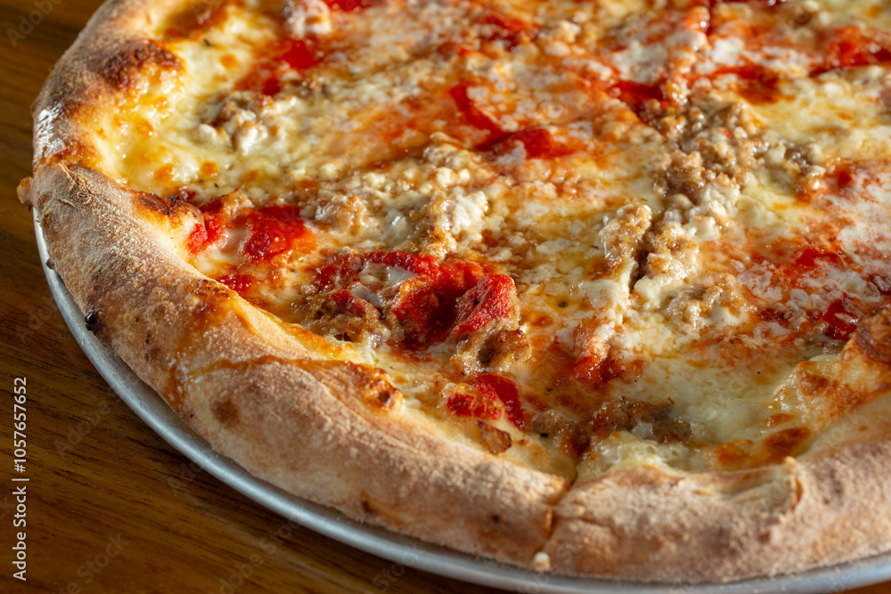 A view of a burrata, sausage and hot honey pizza. A view of a burrata, sausage and hot honey pizza.