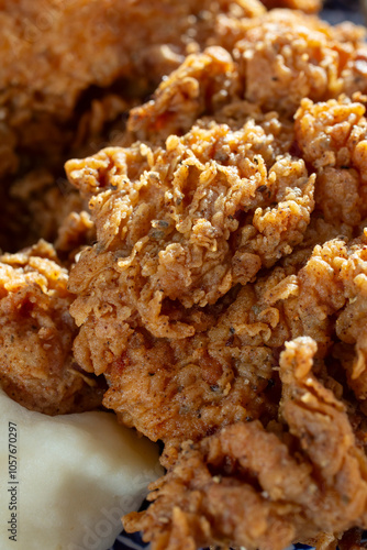 A closeup view of the batter on fried chicken.