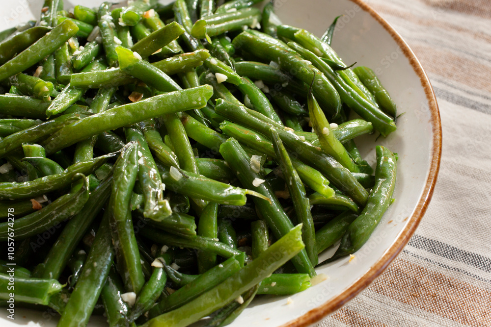 A view of a bowl of garlic green beans.