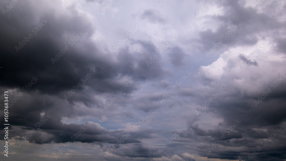 Dark sky with stormy clouds. Dramatic sky rain,Dark clouds before a thunder-storm. Dark sky with stormy clouds. Dramatic sky rain,Dark clouds before a thunder-storm.