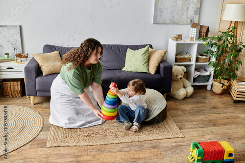 A plus size woman joyfully plays with her daughter, fostering creativity and bonding at home. photo