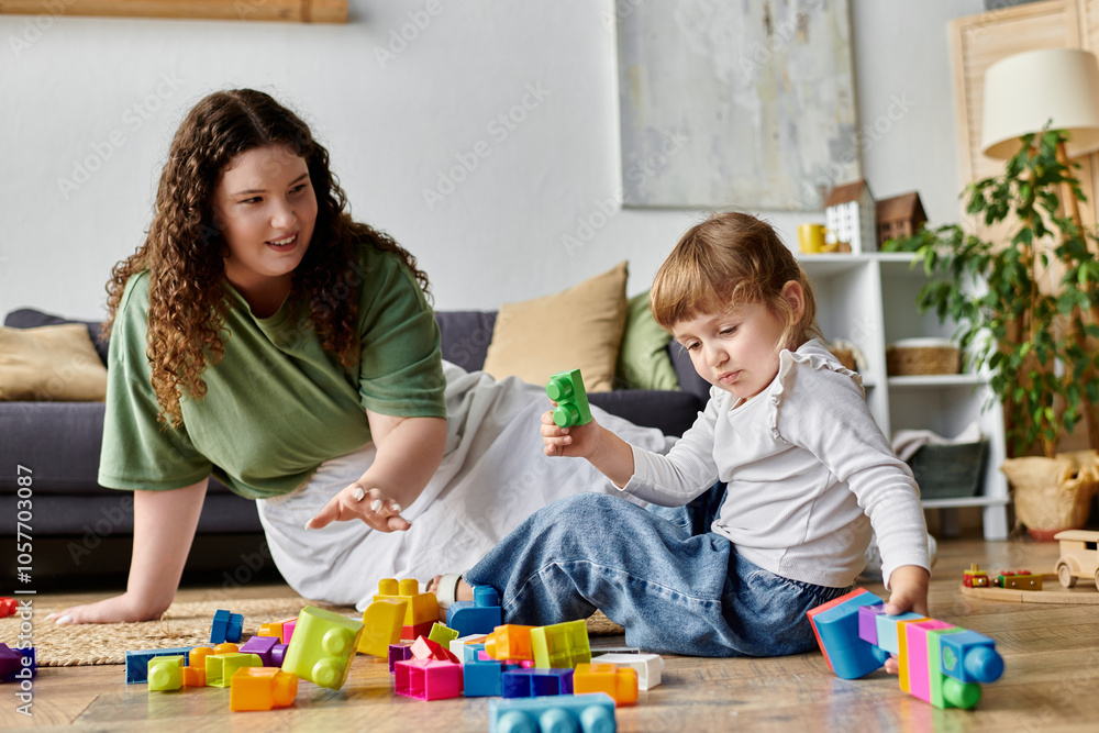 A mother and daughter enjoy quality time playing with vibrant building blocks on the floor. A mother and daughter enjoy quality time playing with vibrant building blocks on the floor.