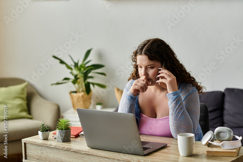 Concentrated woman with dark hair working at home.