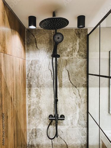 In the bathroom, a beautifully designed ceilingmounted shower head serves as a crucial fixture for users seeking invigorating and refreshing showers, enhancing their bathing experience photo