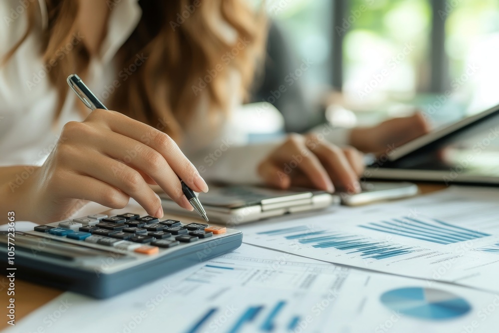 Women business people use calculators to calculate the company budget and income reports on the desk in the office, Generative AI Women business people use calculators to calculate the company budget and income reports on the desk in the office, Generative AI