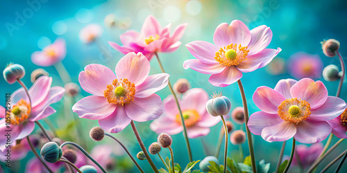 Delicate pink flowers bloom vibrantly against a soft gradient background of green and blue, showcasing the beauty of springtime in a flourishing garden setting