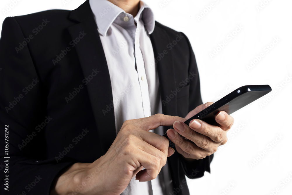 Businessman in black suit standing holding mobile phone to view work data and check work Businessman in black suit standing holding mobile phone to view work data and check work