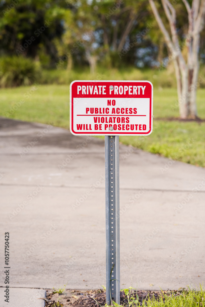 PRIVATE PROPERTY, NO PUBLIC ACCESS, VIOLATORS WILL BE PROSECUTED sign screwed to a metal post, verticle PRIVATE PROPERTY, NO PUBLIC ACCESS, VIOLATORS WILL BE PROSECUTED sign screwed to a metal post, verticle