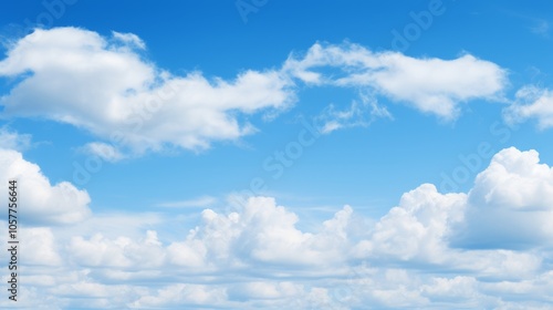 Expansive blue sky with billowy clouds