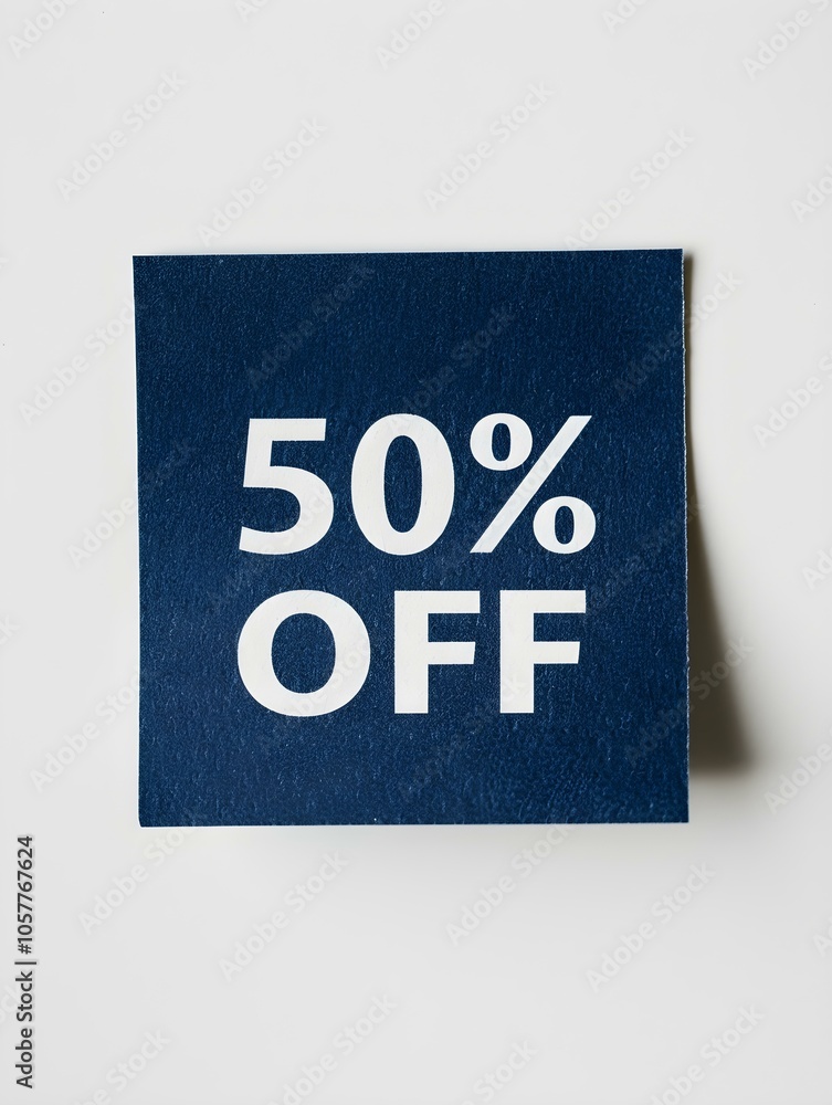 White '50% OFF' Text on a Navy Blue Square Paper Note. White Background White '50% OFF' Text on a Navy Blue Square Paper Note. White Background