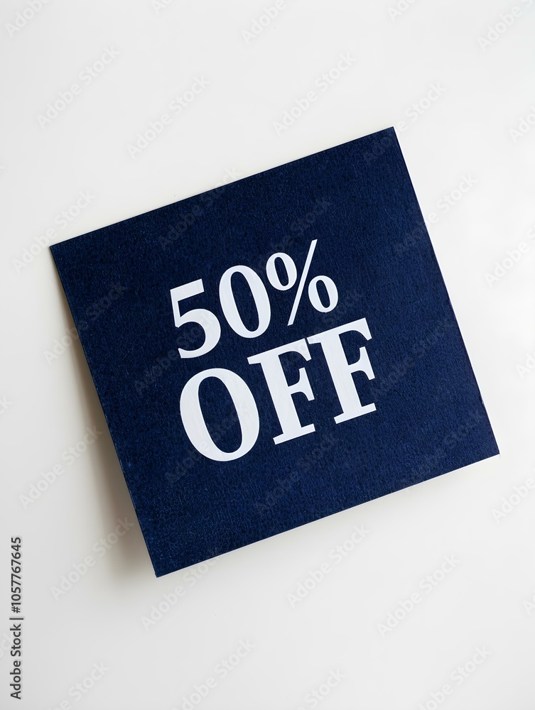 White '50% OFF' Text on a Navy Blue Square Paper Note. White Background White '50% OFF' Text on a Navy Blue Square Paper Note. White Background