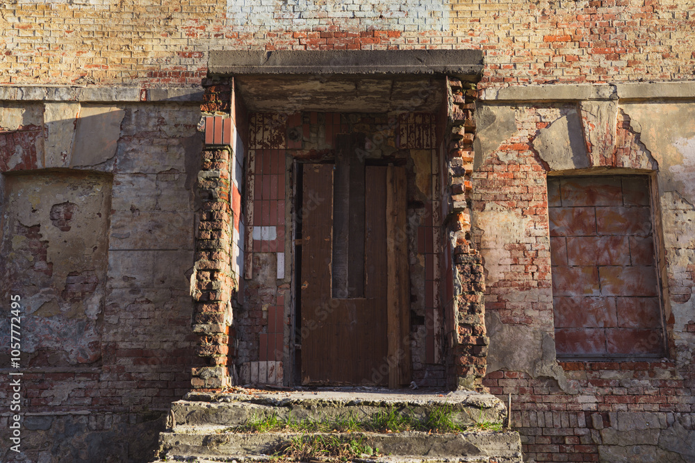 The entrance of an old, abandoned building without doors. The doorway The entrance of an old, abandoned building without doors. The doorway
