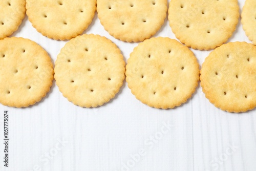 Delicious crispy crackers cookies on wooden background