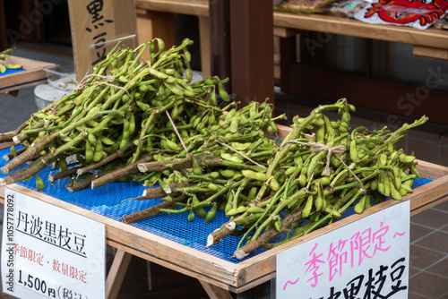Obraz na płótnie Edamame in local market, is an East Asian dish prepared with immature soybeans in the pod. The pods are boiled or steamed and may be served with salt or other condiments w salonie