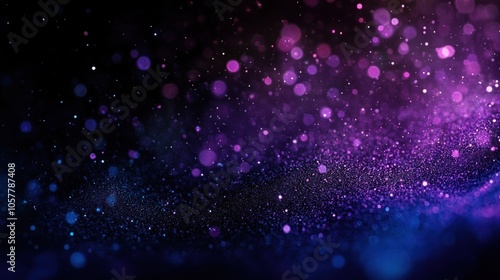Abstract background with purple and blue glitter bokeh effect.