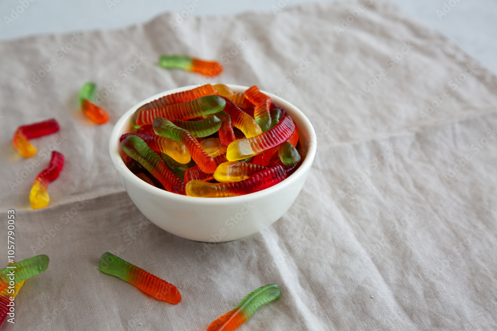 Halloween Sweet Fruit Gummy Worms in a Bowl, side view. Halloween Sweet Fruit Gummy Worms in a Bowl, side view.