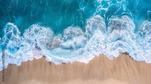 Top-down view of waves washing over the beach with plenty of background copy space photo