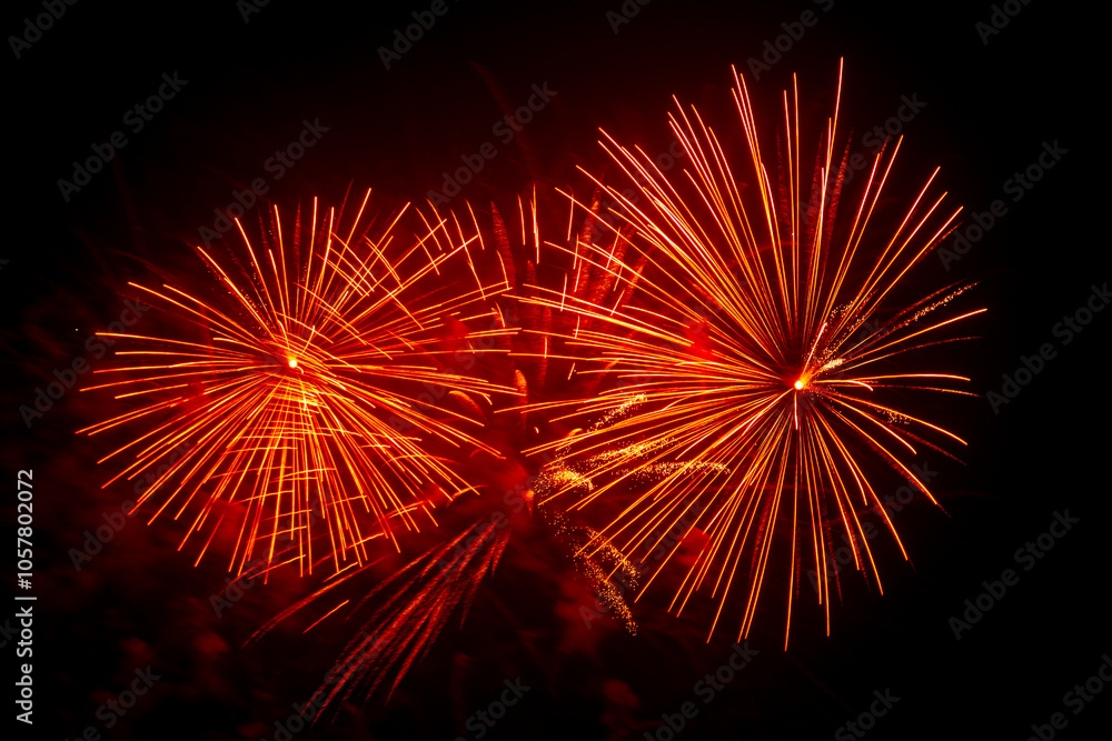Red pink bright sparks of fireworks on the black sky Red pink bright sparks of fireworks on the black sky