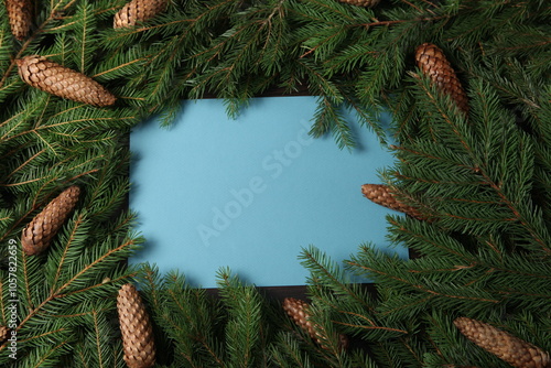 Background for new year 2025. New year's theme on white surface with fir branches. Design for greeting card. photo