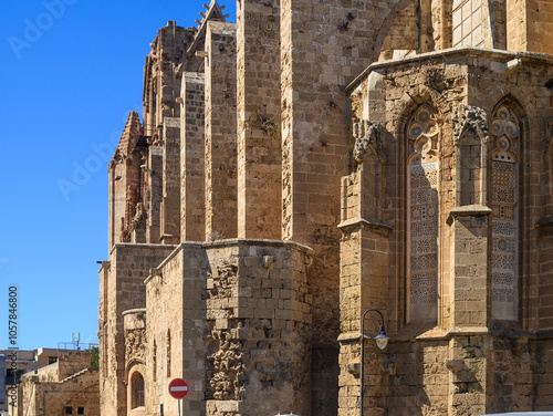 Exploring the intricate architecture of an ancient church under a clear blue sky in Cyprus