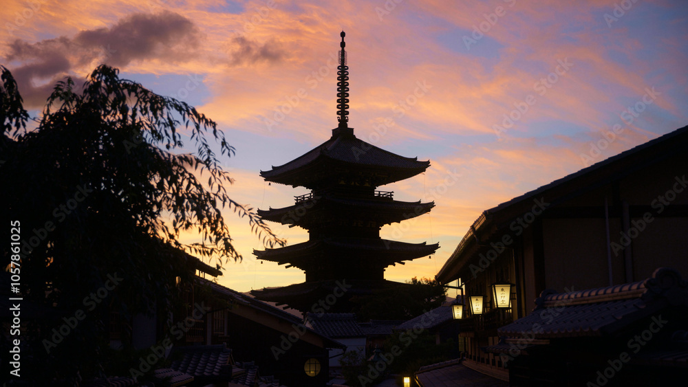 Majestic silhouette of ancient Japanese tower at sunset Majestic silhouette of ancient Japanese tower at sunset