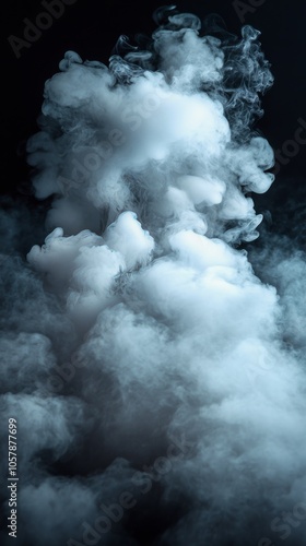 A cloud of thick white smoke rises and twists, creating intricate patterns ag...