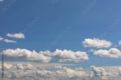 Obraz na płótnie Blue sky with fluffy white clouds, serene background, peaceful skyward view, tranquility and freedom above, calm atmosphere concept w salonie