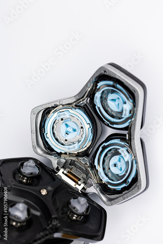 Obraz na płótnie Beard electric shaver on a white background. Inside view of the cutting blades . Photo taken in artificial light with clearly visible details of the shaver w salonie