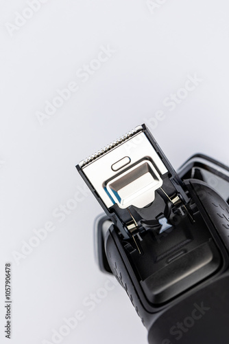 Obraz na płótnie Beard shaver on a white background. Macro close-up of the trimming cutting blades. Photo taken in artificial light with clearly visible details of the shaver w salonie