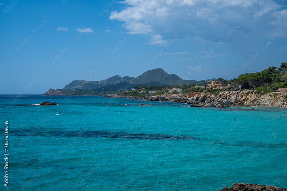 Cala Rajada near son moll beach, Mallorca with sea in front and mountain range in the background, wide angle shot, majorca spain Cala Rajada near son moll beach, Mallorca with sea in front and mountain range in the background, wide angle shot, majorca spain