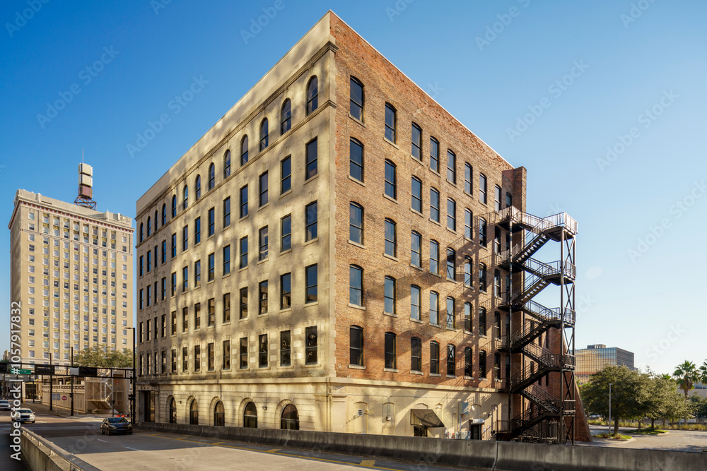 Old brick building with emergency fire escape ladder Old brick building with emergency fire escape ladder