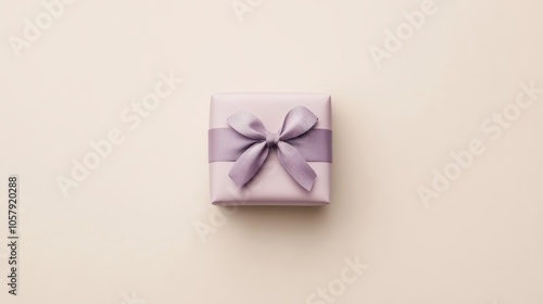 Elegant Gift Box with Lavender Ribbon on Neutral Background