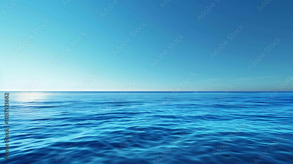 Deep blue ocean. The surface of the water is calm and still. The sky is clear and blue. The horizon is distant and meets the water in a perfect line. Deep blue ocean. The surface of the water is calm and still. The sky is clear and blue. The horizon is distant and meets the water in a perfect line.