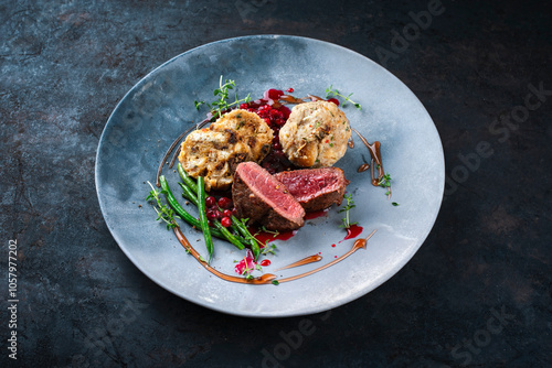 Bilde på lerret Traditionally roasted fillet of saddle of venison with bread dumplings, mushroom