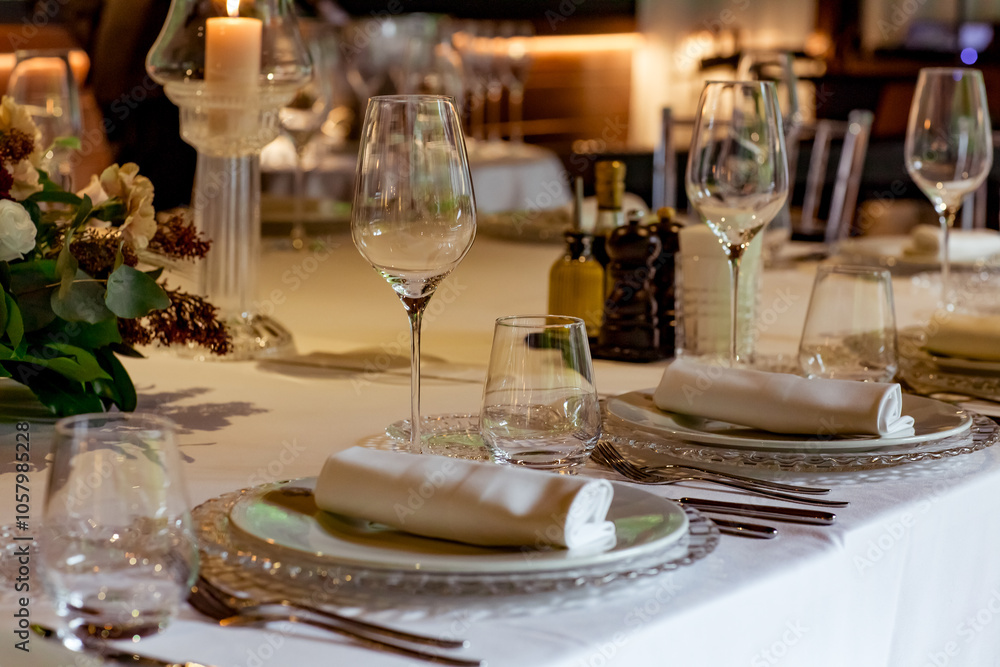 Beautiful table setting, for a holiday. with the dishes .flowers and candles Beautiful table setting, for a holiday. with the dishes .flowers and candles